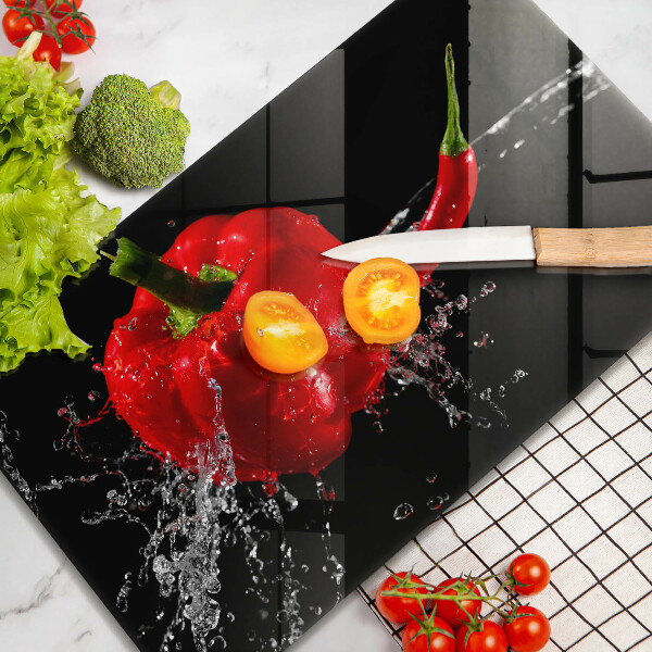 Osłona ściany przy kuchence gazowej Czerwone papryki w wodzie