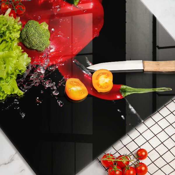 Osłona ściany przy kuchence gazowej Czerwone papryki w wodzie